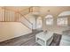 Living room featuring a staircase, high ceilings and neutral decor at 11740 Via Esperanza Ave, Las Vegas, NV 89138