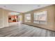Spacious living area with large windows and hardwood floors at 11740 Via Esperanza Ave, Las Vegas, NV 89138