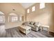 Living room with vaulted ceilings, gray flooring and neutral walls at 11740 Via Esperanza Ave, Las Vegas, NV 89138