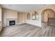 Bright living room with fireplace and hardwood floors at 11740 Via Esperanza Ave, Las Vegas, NV 89138