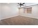 Bright bedroom with ceiling fan and neutral colored carpet at 126 Cricklewood Ave, Henderson, NV 89002