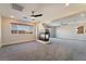Bright bedroom with fireplace, carpet, and ceiling fan at 126 Cricklewood Ave, Henderson, NV 89002
