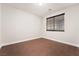 Spacious bedroom with wood-look floors and large window at 126 Cricklewood Ave, Henderson, NV 89002