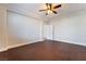 Well-lit bedroom, ceiling fan, hardwood floors at 126 Cricklewood Ave, Henderson, NV 89002