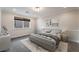 Primary bedroom with bed, nightstands, and stylish decor at 126 Cricklewood Ave, Henderson, NV 89002