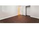 Simple bedroom with wood-look floors and access to bathroom and closet at 126 Cricklewood Ave, Henderson, NV 89002