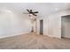 Spacious bedroom with ceiling fan, carpet, and access to hallway and closets at 126 Cricklewood Ave, Henderson, NV 89002