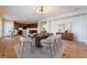 Modern dining room with a large table and kitchen views at 126 Cricklewood Ave, Henderson, NV 89002
