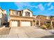 Two-story house with three-car garage and desert landscaping at 126 Cricklewood Ave, Henderson, NV 89002