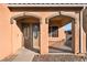 Home exterior with double doors and a covered entryway at 126 Cricklewood Ave, Henderson, NV 89002