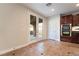 Kitchen with dark wood cabinets, granite counters, and tile flooring at 126 Cricklewood Ave, Henderson, NV 89002