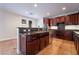 Spacious kitchen with island, granite counters, and stainless steel appliances at 126 Cricklewood Ave, Henderson, NV 89002