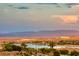 Stunning aerial view of lakefront community with mountain backdrop at 176 Kimberlite Dr, Henderson, NV 89011