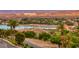 Luxury homes and lakefront community with palm trees and mountain views at 176 Kimberlite Dr, Henderson, NV 89011