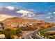 Aerial view of modern homes on hillside with mountain views at 176 Kimberlite Dr, Henderson, NV 89011
