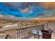 Private balcony boasting scenic sunset and mountain views at 176 Kimberlite Dr, Henderson, NV 89011