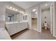 Elegant bathroom with double vanity, large mirror, and walk-in closet at 176 Kimberlite Dr, Henderson, NV 89011