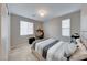 Bright bedroom with striped bedding and built-in workspace at 176 Kimberlite Dr, Henderson, NV 89011