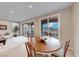 Bright dining area with wooden table and access to backyard patio at 176 Kimberlite Dr, Henderson, NV 89011