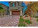 Brick paved driveway and two-story home exterior at 176 Kimberlite Dr, Henderson, NV 89011