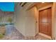 Home's exterior with a wood front door and stone walkway at 176 Kimberlite Dr, Henderson, NV 89011