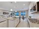 Modern kitchen with island, stainless steel appliances, and light cabinets at 176 Kimberlite Dr, Henderson, NV 89011