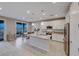 Open concept kitchen with island, stainless steel appliances, and view of living room at 176 Kimberlite Dr, Henderson, NV 89011