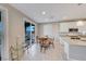 Kitchen with white cabinets, stainless steel appliances, and access to patio at 176 Kimberlite Dr, Henderson, NV 89011