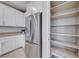 Modern kitchen features white cabinets, stainless steel appliances, and a spacious pantry at 176 Kimberlite Dr, Henderson, NV 89011