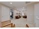 Bright and airy living area with seating and access to bedroom at 176 Kimberlite Dr, Henderson, NV 89011