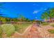 Community park with grassy areas, brick walkways, and a shaded seating area at 176 Kimberlite Dr, Henderson, NV 89011