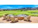 Relaxing patio with firepit overlooking a golf course at 176 Kimberlite Dr, Henderson, NV 89011