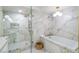 Spa-like bathroom with marble shower and soaking tub at 1901 Summer Pine Ct # 101, Las Vegas, NV 89134