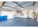 Finished garage with overhead storage and epoxy floor at 1901 Summer Pine Ct # 101, Las Vegas, NV 89134