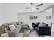 Bright living room with wood floors, neutral colors, and comfortable seating at 1940 E Golden Arrow Dr, Las Vegas, NV 89169