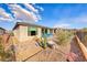 Low-maintenance backyard with desert landscaping, rock accents, and cozy patio area at 29 Sun Mirage Ave, Henderson, NV 89011