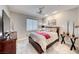Relaxing bedroom with comfortable carpet, a ceiling fan, and stylish decor at 29 Sun Mirage Ave, Henderson, NV 89011