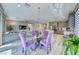 Open concept dining area next to living room and featuring a modern chandelier at 29 Sun Mirage Ave, Henderson, NV 89011