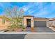Charming single-story home with well-manicured landscaping and a two-car garage at 29 Sun Mirage Ave, Henderson, NV 89011