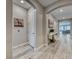 Elegant hallway with wood-look flooring, arched entryway, and stylish decor at 29 Sun Mirage Ave, Henderson, NV 89011