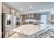 Spacious kitchen featuring stainless steel appliances, large island, and contemporary finishes at 29 Sun Mirage Ave, Henderson, NV 89011
