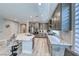 Well-equipped kitchen boasts stainless steel appliances, a kitchen island with bar seating, and ample cabinet space at 29 Sun Mirage Ave, Henderson, NV 89011