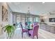 This spacious living room features an elegant chandelier and outdoor views from the sliding glass doors at 29 Sun Mirage Ave, Henderson, NV 89011