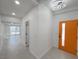 Bright entryway with orange door and view to living area at 3212 Gaucho Dr, Las Vegas, NV 89169