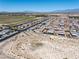 Wide aerial shot of a desert community with single-story homes and mountain views at 3543 E Wallowa Dr, Pahrump, NV 89061