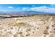 Scenic aerial view of a desert community with walking paths and distant mountains at 3543 E Wallowa Dr, Pahrump, NV 89061