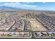 Extensive aerial image of a Primary-planned desert community with mountain views at 3543 E Wallowa Dr, Pahrump, NV 89061