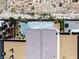 Aerial view of a backyard with patio, garden and play equipment at 3543 E Wallowa Dr, Pahrump, NV 89061