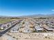 Aerial view of a neighborhood showcasing desert landscaping and mountain views at 3543 E Wallowa Dr, Pahrump, NV 89061