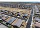 Expansive aerial view of a residential community showcasing neat streets and uniform house design at 3543 E Wallowa Dr, Pahrump, NV 89061